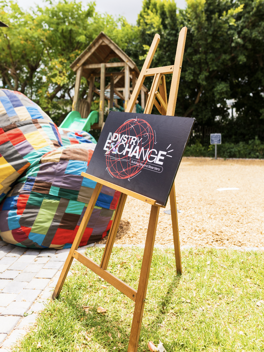 Indvstry Exchange easel signage at a Cape Town venue